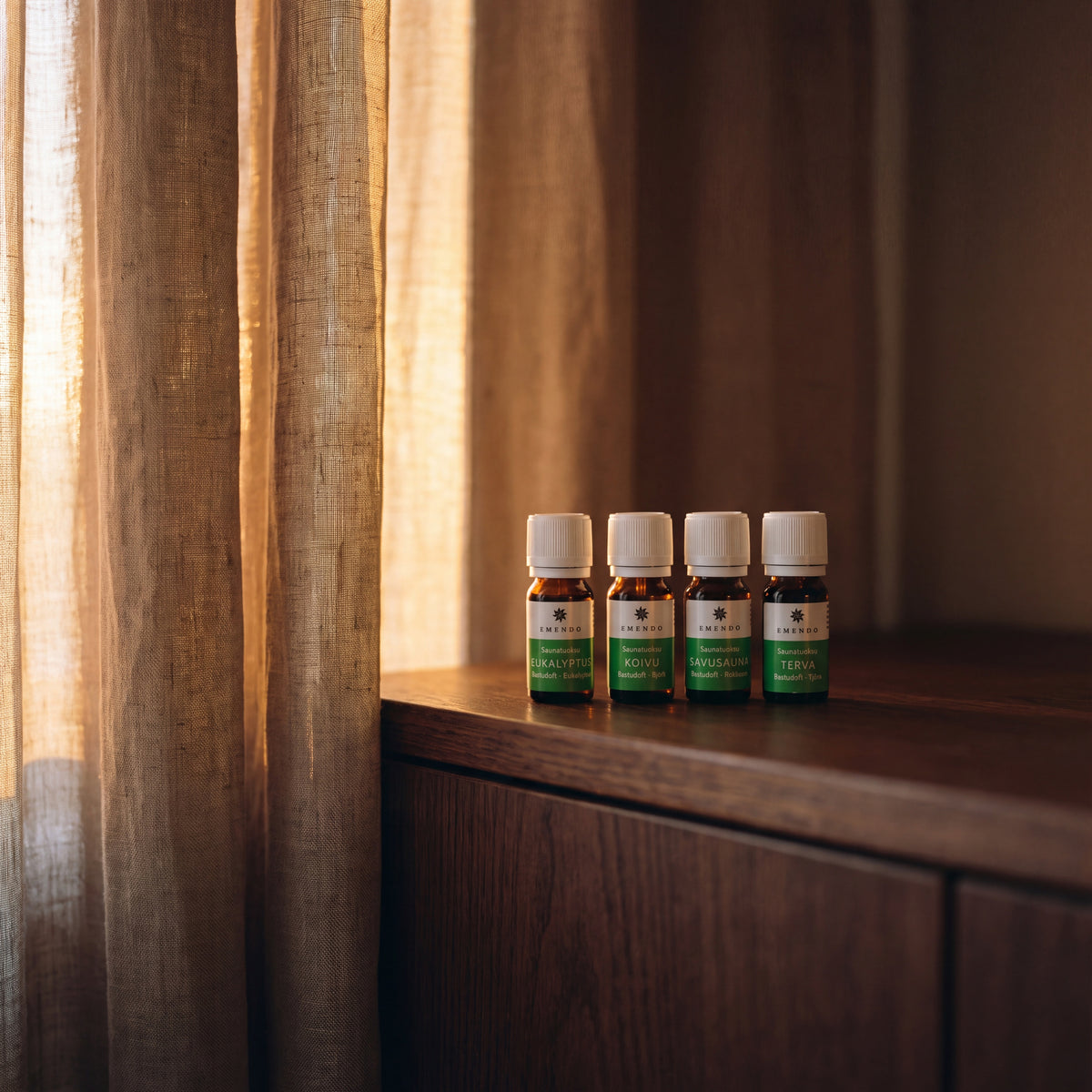 Emendo Sauna Scents (4 x 10ml) - lifestyle by linen curtain