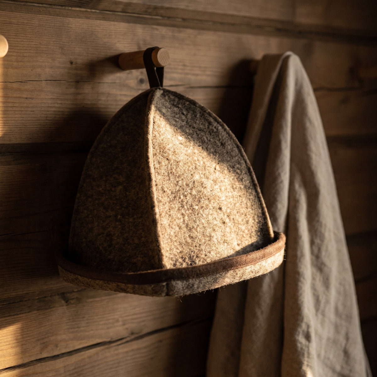 Emendo Felt Sauna Hat Brown - hanging on a sauna peg