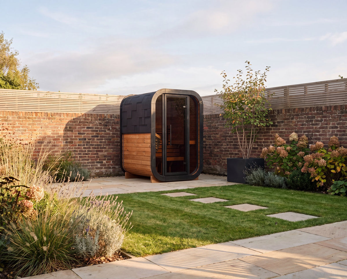 Ralva Small rounded outdoor sauna cabin, wide studio view