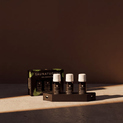 Emendo Black Sauna Scent Wall Rack Set (3 x 10ml) - lifestyle in sunlight