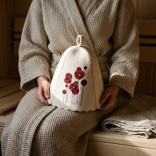 White Felt Sauna Hat with Poppies Embroidery - held in hands