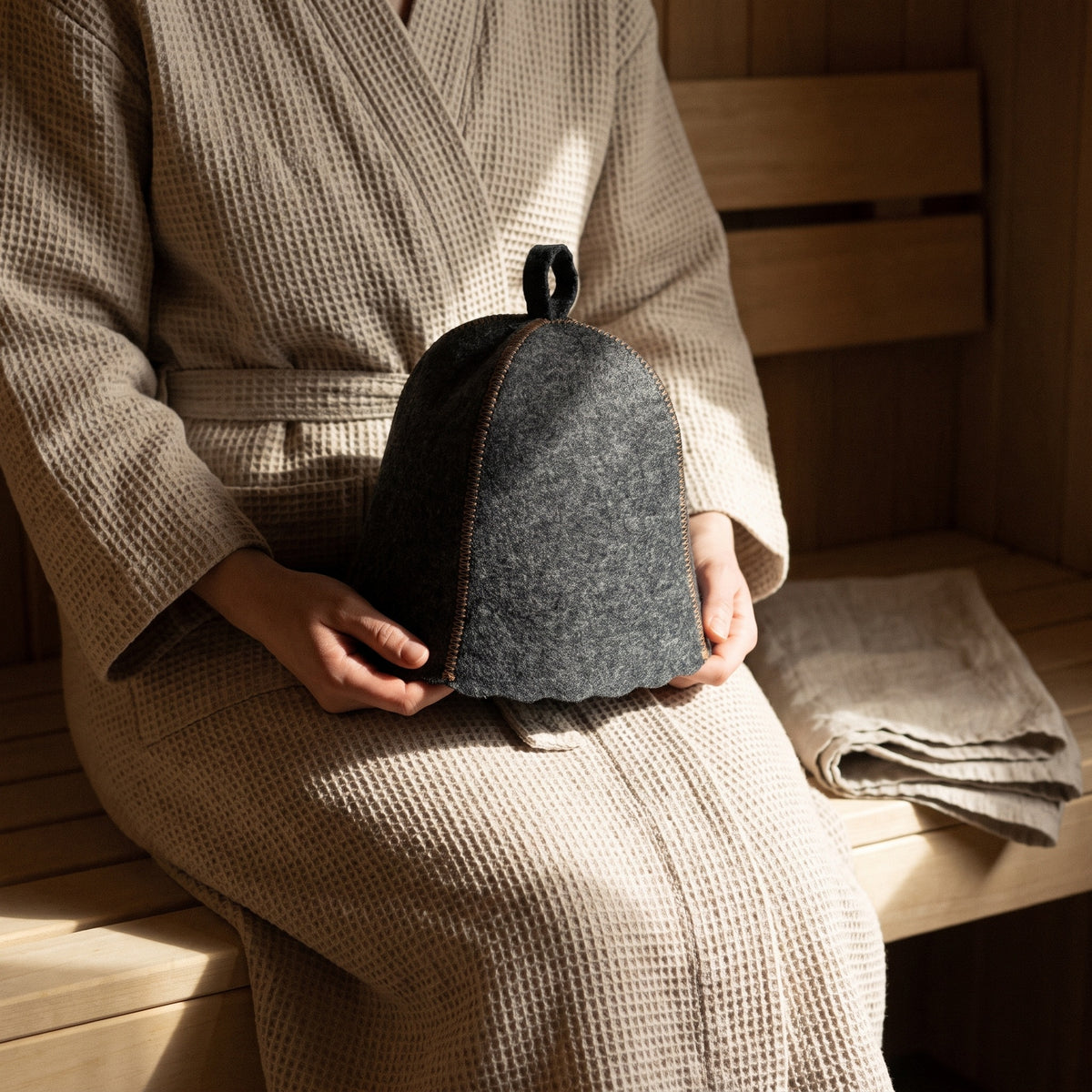 Traditional Lightweight Grey Felt Sauna Hat - held in hands
