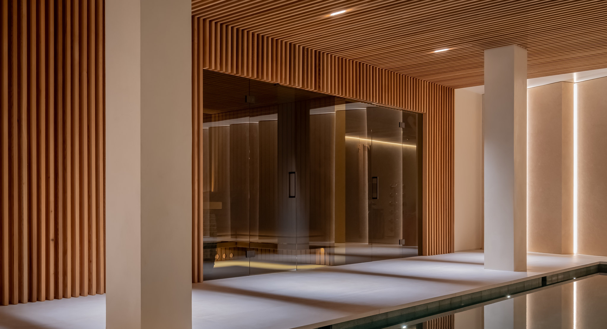 Modern interior with wooden slat walls and reflective surfaces