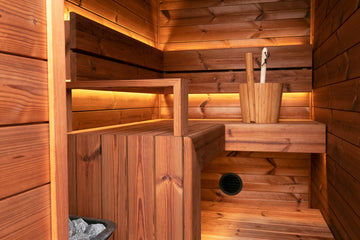 L-Shaped Bench Thermo Pine Sauna Installation. This Thermo Pine Sauna Installation has an L shaped upper bench, a raised floor, backrest, armrest and mitred waterfall edge on the bench. The Sauna Heater is a Narvi NC Electric Sauna Heater