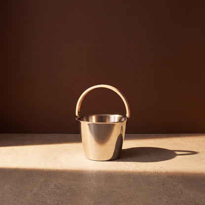 Rento x Harri Koskinen Glossy Steel Sauna Pail - lifestyle in sunlight