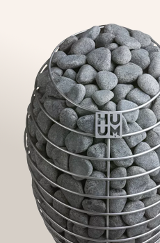 Decorative basket filled with gray stones on a light background