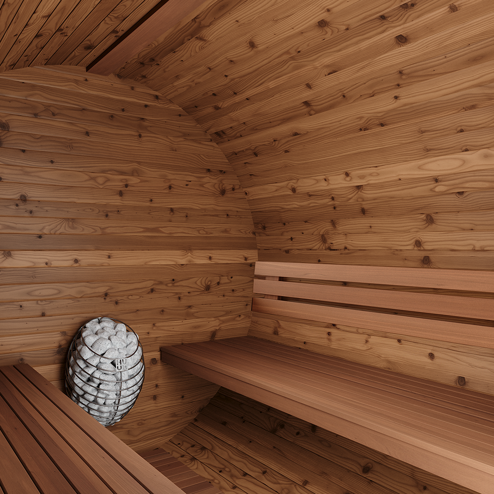 Wooden sauna interior with a bench and basket of rocks.
