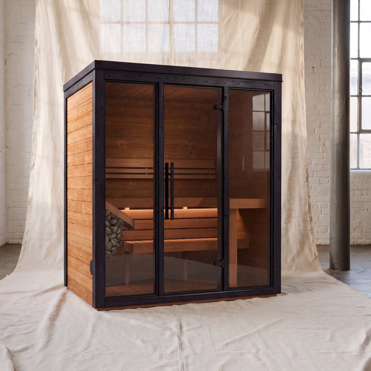 Fjelda Medium outdoor sauna with a three-panel bronze tinted glazed front