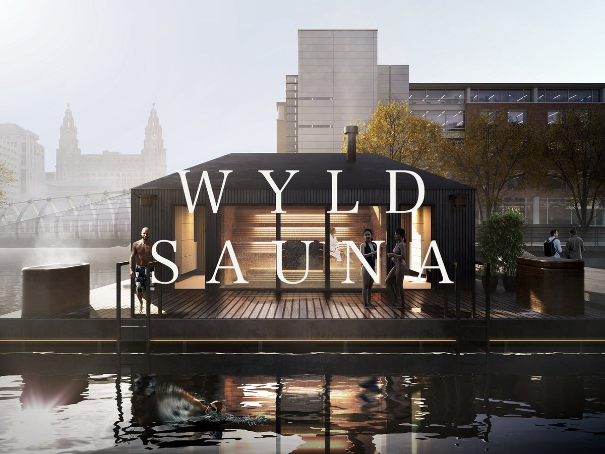 Wyld Sauna with people around it by a body of water in an urban setting