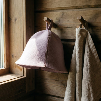 Traditional Lightweight Light Lavender Felt Sauna Hat - hanging on a sauna peg