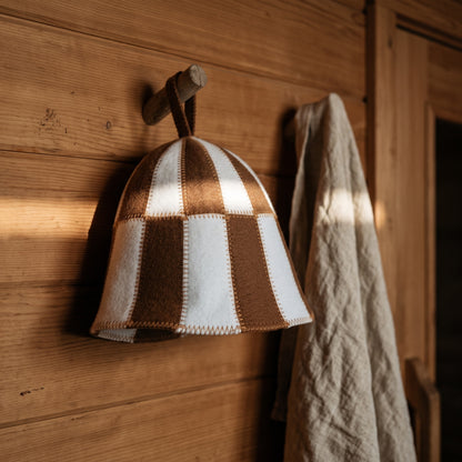 Sauna Hat Brown/White (Polyester Felt) - hanging on a sauna peg