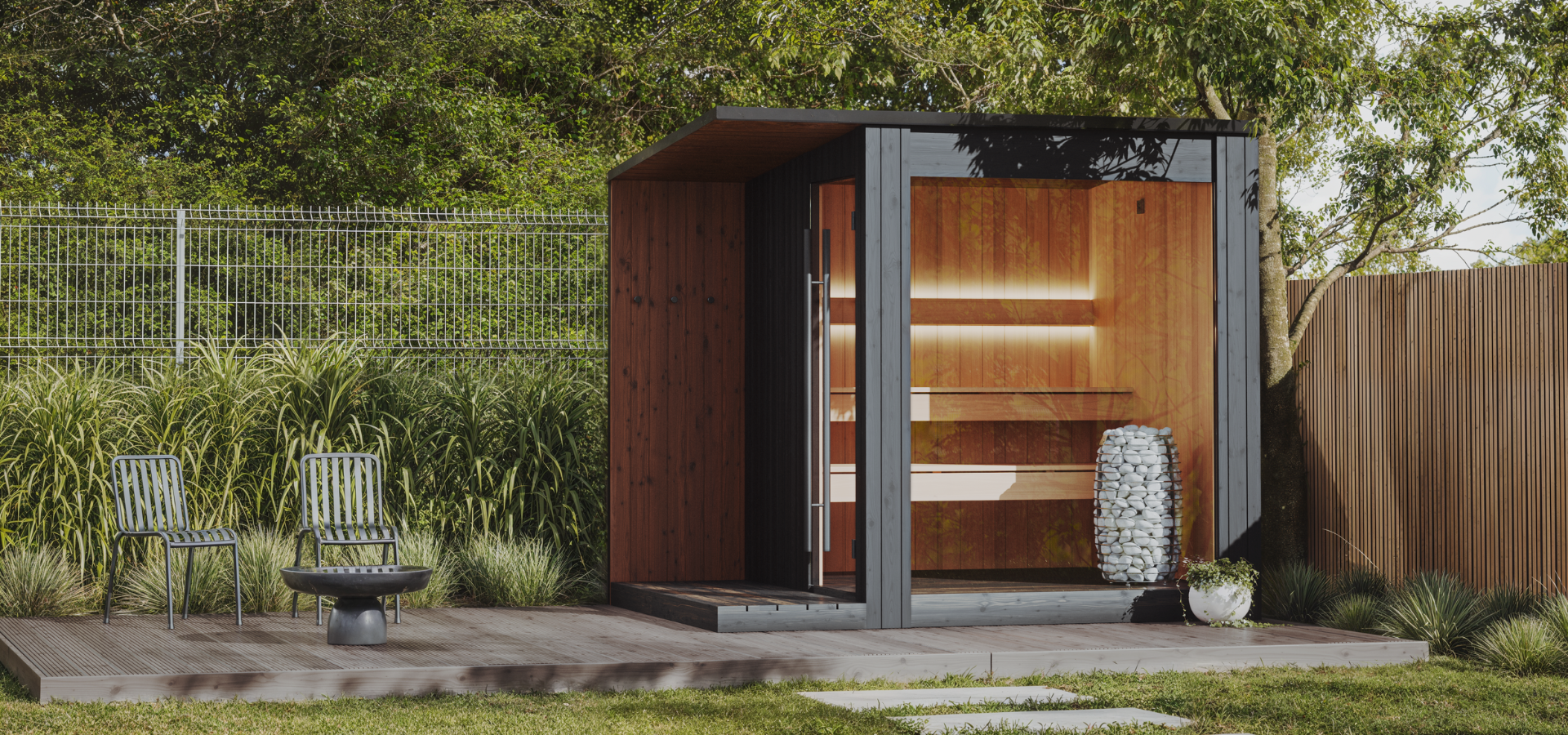 Modern outdoor cabin with wooden interior, surrounded by greenery and chairs.