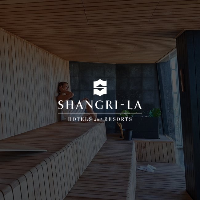 Person in a sauna with Shangri-La Hotels and Resorts logo overlay