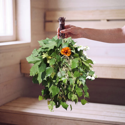 Sauna Whisk Herbal - held in the sauna