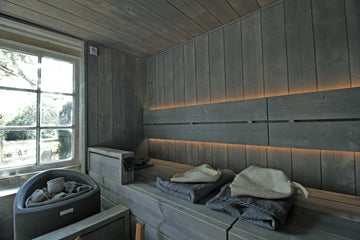 Bespoke Sauna Installation by Finnmark Sauna using brushed spruce. The sauna wood is grey due to the use of Grey Supi Sauna Wax. The sauna heater is a Narvi Trio electric sauna heater.