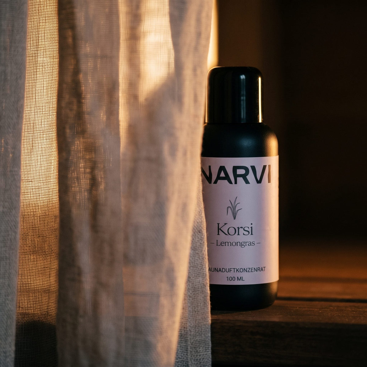 Lemongrass Sauna Scent by Narvi (100ml) - lifestyle behind linen curtain