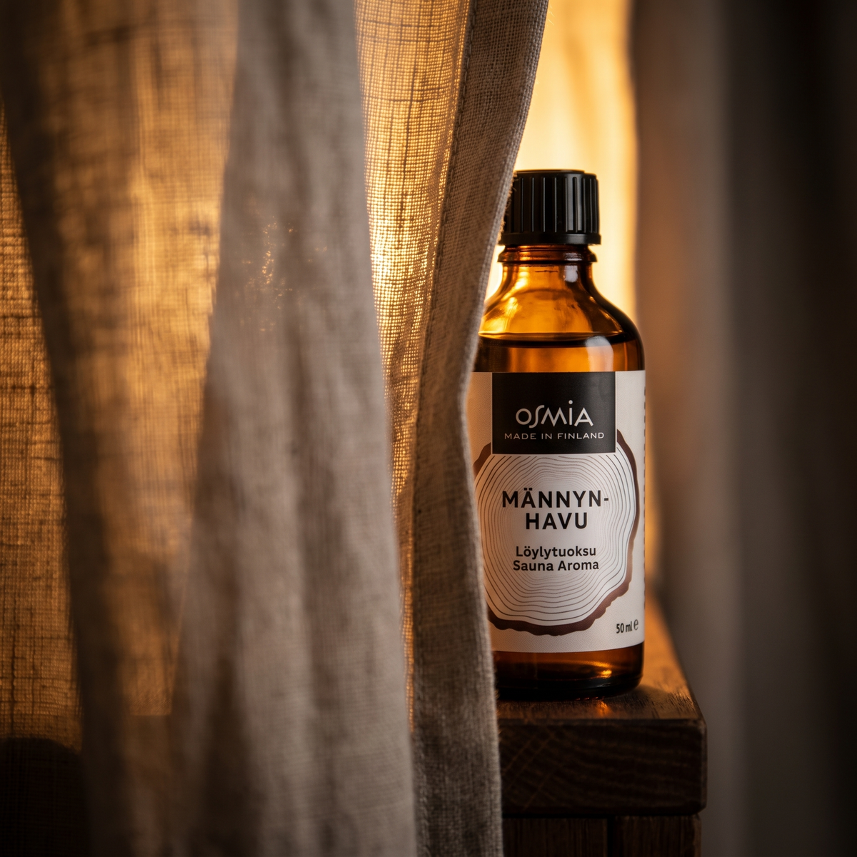 Pine Forest Sauna Aroma by Osmia (50ml) - lifestyle behind linen curtain