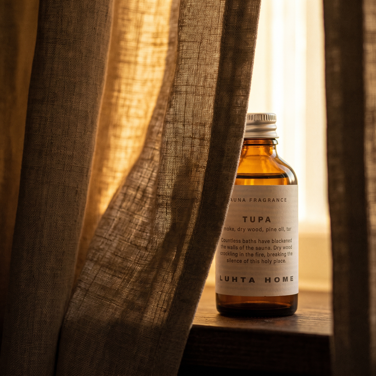 Luhta Tupa Sauna Oil Drops - lifestyle behind linen curtain