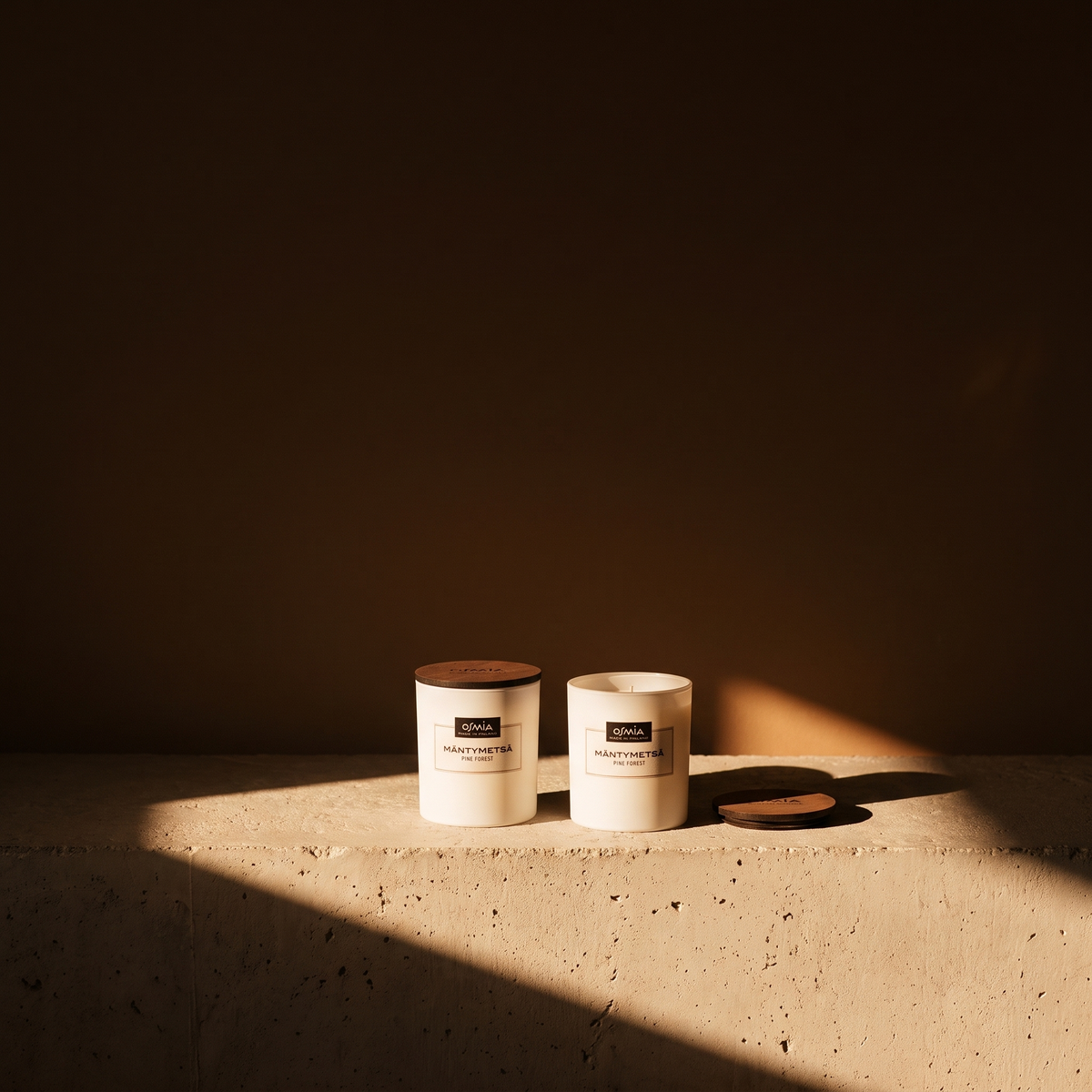 Pine Forest (Mäntymetsä) Scented Candle by Osmia - lifestyle in sunlight