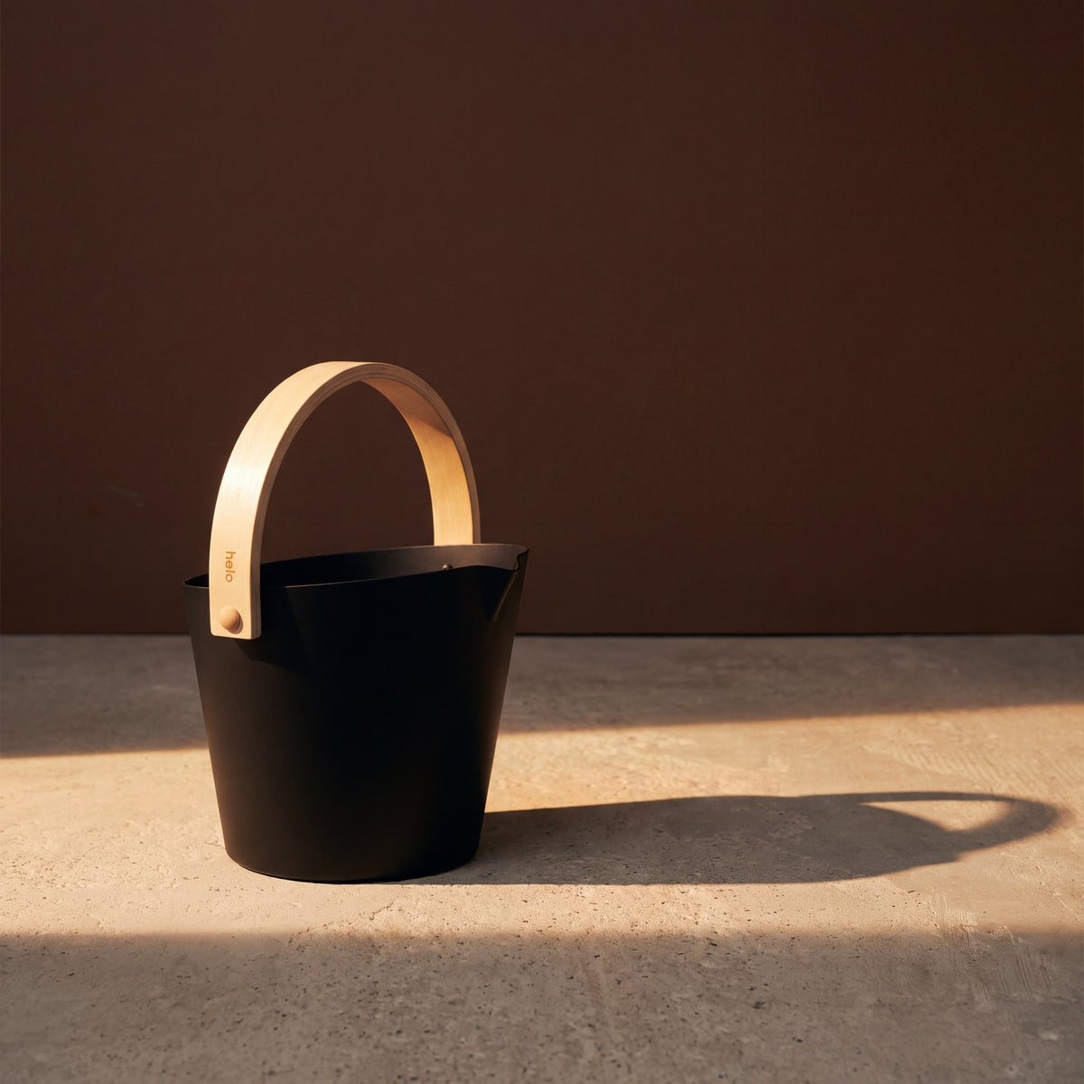 Black Anodised Aluminium Sauna Bucket (Brilliant Range) by Helo - lifestyle in sunlight