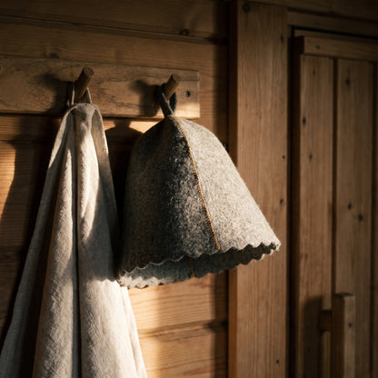 Traditional Grey Sauna Hat 100% Wool - hanging on a sauna peg