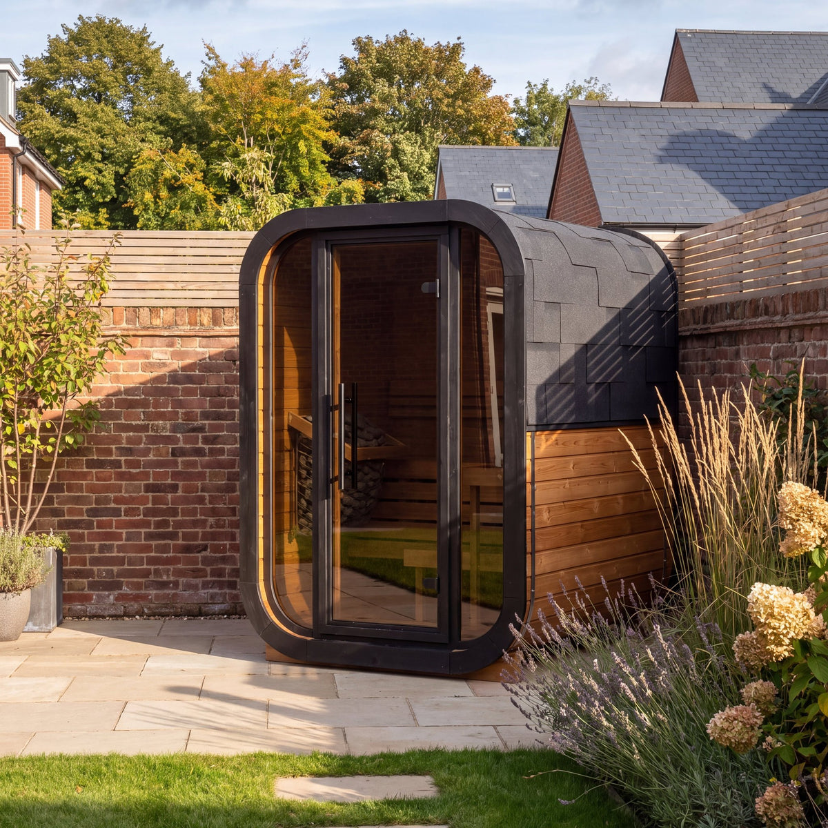 Ralva Small outdoor sauna showing the curve carried from roof to base