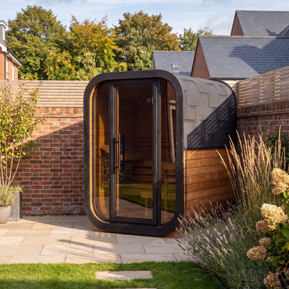 Ralva Small outdoor sauna showing the curve carried from roof to base