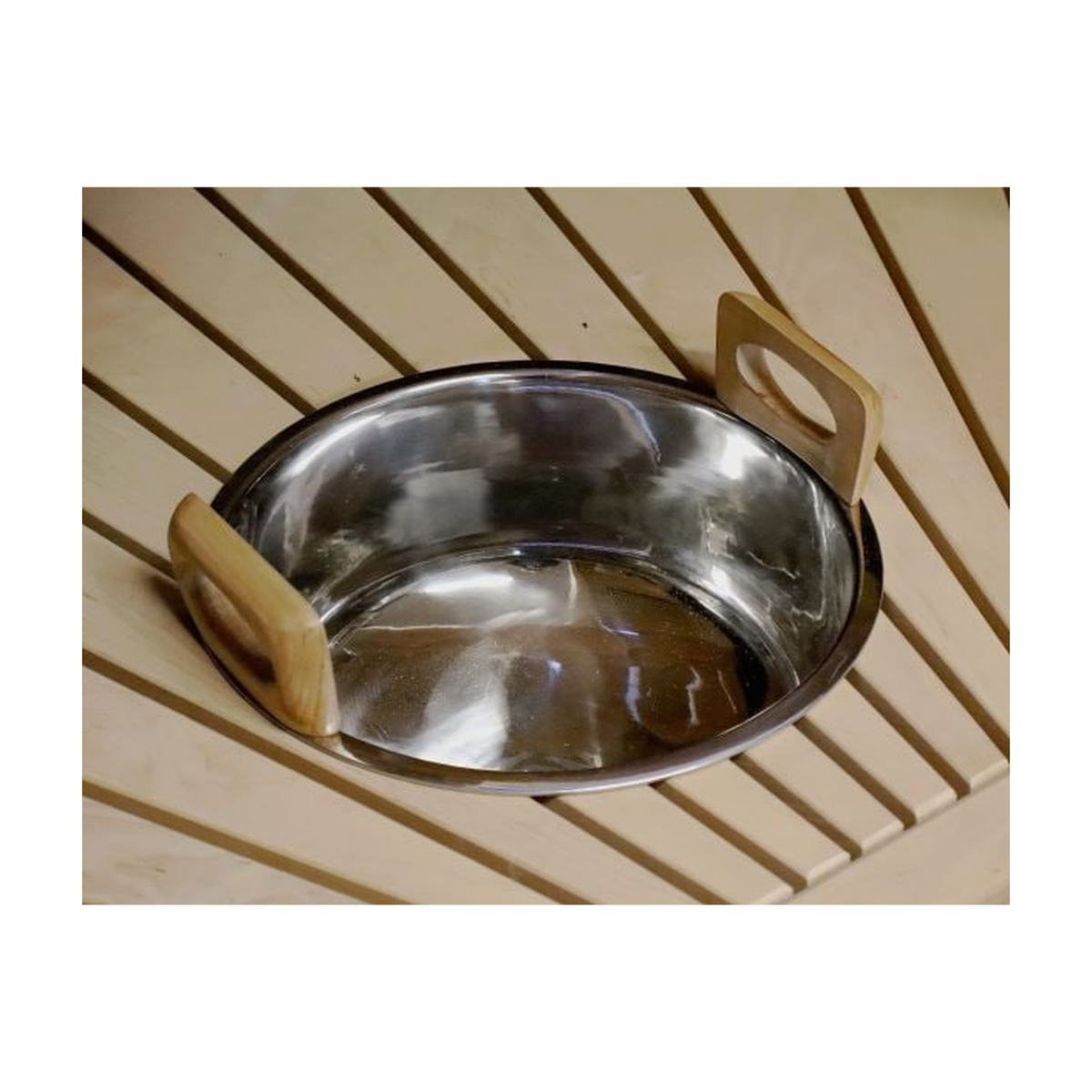 Nine litre sauna water bowl recessed into a timber bench