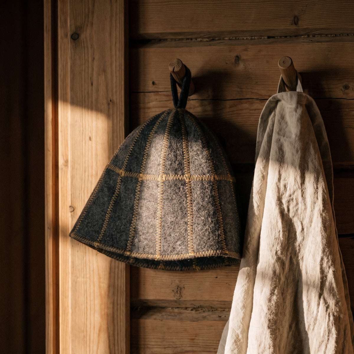 Sauna Hat Grey (Wool Felt) - hanging on a sauna peg